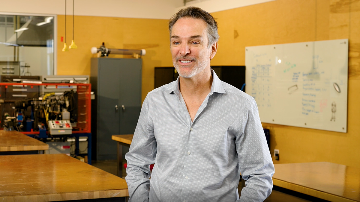 Screenshot of Tom Mueller with Engineering Design Center behind him.